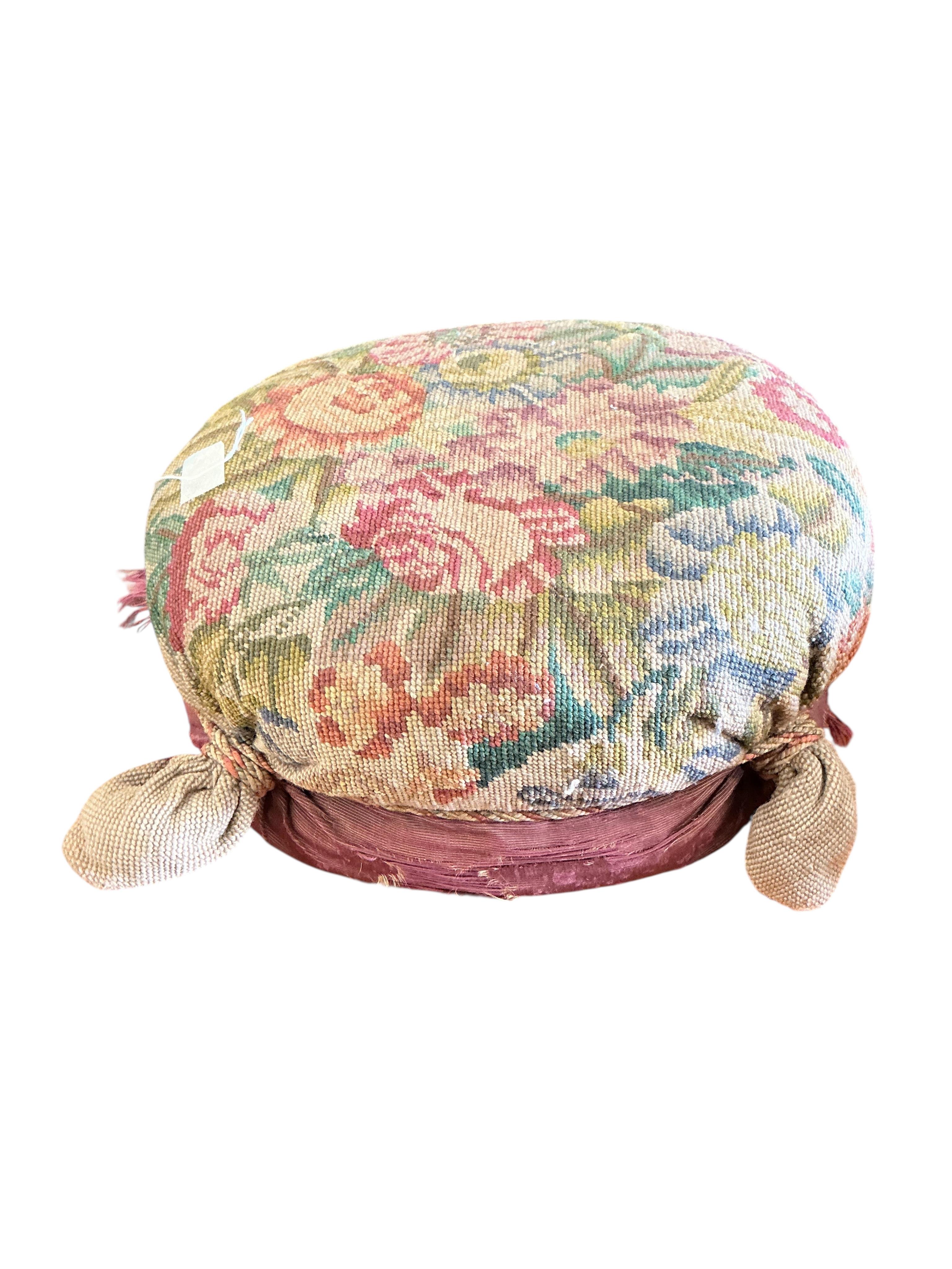 Two Victorian floral tapestry footstools, larger diameter 38cm
